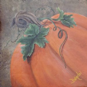 Featuring three-quarter view of a large orange pumpkin tilting to the left with two large green leaves and a vine that twists down the side of the pumpkin. The background is textured in colors of browns and blacks.